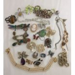 A collection of vintage costume jewellery to include brooches, necklaces and bracelets.