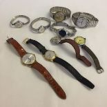 A collection of mens and ladies wrist watches to include: Pulsar, Citizen and Polaris.