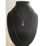 A 24" 8ct gold chain together with a haematite pendant on a gold chain.