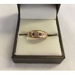 A 15ct gold gents ring set with small garnets and seed pearls. Total weight approx 2.6g. Size S1/2.