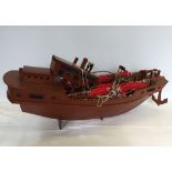 A large ornamental wooden boat in need of restoration, approx 85cm long.