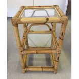 Bamboo side table with glass shelves. Measures approx 14.5" square x 24" tall.