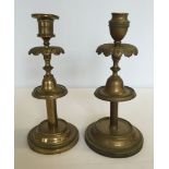 2 Edwardian brass candlesticks.