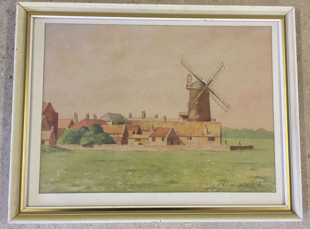 A framed and glazed watercolour signed T WAITS, possibly Cley Windmill. Approx 37 x 27cm.