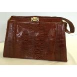 A vintage lizard skin ladies handbag with lovely soft leather interior.