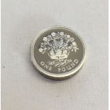 A silver proof piedfort 1986 £1 coin.