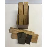 A box of military wooden splints and metal joints.