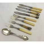 A collection of vintage silver plated fish knives & forks plus a spoon. Most with faux ivory handles