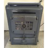 A vintage grey enamelled 'Siesta' wood burning stove. Approx 51cm wide, 68cm tall and 31cm deep (