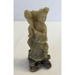 A soapstone oriental figurine of a Chinese lady. 11cm tall.