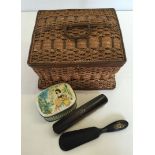 A vintage wicker needlework basket with contents.