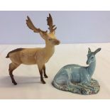 2 Beswick deer figurines a/f: a stag in tan matte finish and a blue gloss finish deer sitting.