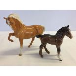 2 Beswick Horses a/f: a palomino horse #1549 (small chip to hoof) and a shire foal #951 in gloss