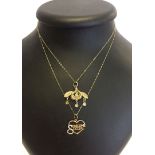 A gold on silver pendant on a 9ct gold trace chain. Together with a 9ct gold pendant with a heart