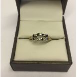 Pretty 9ct gold dress ring set with diamonds and sapphire on a split shank mount. Size N, total