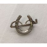 Antique silver horseshoe and riding crop brooch. Hallmark Chester 1898, maker J & R Griffin.