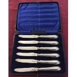 A set of 6 hallmarked silver fruit knives in the original blue velvet lines case. The blades are