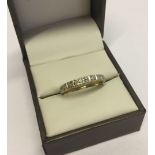 Ladies 9ct gold hallmarked half eternity ring set with small diamonds. Size R, weight approx 2.3g.