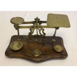 Vintage Post Office letter scales and 5 weights.
