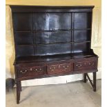 A Georgian oak 3 drawer dresser with later back.