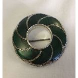 Large white metal and malachite brooch with top ring to use as a pendant. Measures 5cm in diameter.