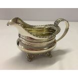 A silver cream boat with partial hallmarking. Weight approx 231g.