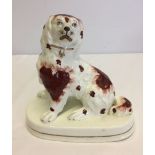 Early Staffordshire porcelain dog c1840. 14.5cm tall.