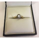 Gold and diamond solitaire ring size O. Small diamonds in an illusion setting. Hallmark rubbed.