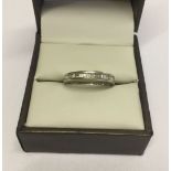 Hallmarked 9ct white gold half eternity ring set with channel set diamonds. Size N. Total weight