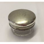 Glass jar with silver lid. 60mm diameter x 35mm deep. Lid has a large letter B engraved on it. The
