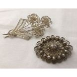 2 filigree white metal brooches.