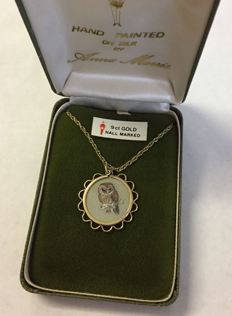 9ct gold pendant mount containing a handpainted miniature of an owl on silk (under glass) by Anna