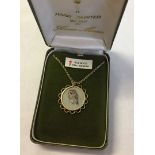 9ct gold pendant mount containing a handpainted miniature of an owl on silk (under glass) by Anna