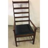 An antique, country estate made, large ladder back elbow chair. Georgian design with inlaid stags