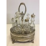 Victorian 7 bottle cruet in galleried silver plated stand.