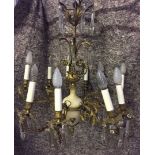 A vintage brass chandelier with cream marble centre, 5 branches set with 10 lights. Converted to