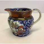 Early English pottery jug, copper lustre, oriental themes. 9.5cm tall.