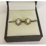 Pretty 9ct gold earrings set with oval opals.