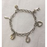 Charm bracelet with 6 charms. Bracelet stamped 925. Total weight approx 14.3g.