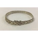 Unusual silver zig-zag design ladies bracelet. Fastening with safety clasp, weight approx 15.9g.