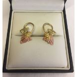 Three colour 12ct gold earrings with a grape vine design. Total weight approx 2.5g.