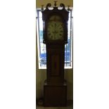 A wooden cased Grandfather clock with handpainted decoration to face and brass Eagle finials to top.