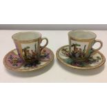 2 Dresden cabinet cups & saucers with overglaze blue mark and impressed 22. One with pink panels,