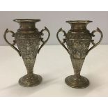 A pair of indian silver 2 handled vases. Each 125mm high and 50mm in diameter. Weight approx 225g.