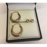 A pair of 9ct gold hoop earrings with white gold highlights weighing approx 0.8g, together with a