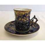 A royal blue and gold Copelands china coffee can, in a Mappin & Webb cup holder with cherub