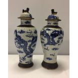 2 Chinese blue & white lidded vases, one with 5 toed dragon decoration, one with 4 toed dragon