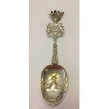 Silver spoon 19cm long weighing approx 73 grams. Has engraved bowl of a windmill, a city crest on