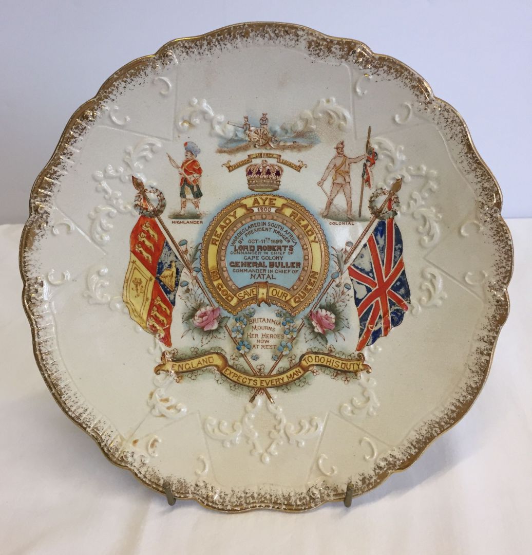 A Boer War commemorative ceramic plate. Reads 'Ready Aye Ready, God save our Queen' (slight hairline