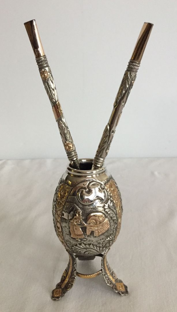 An ornate silver Yerba Mate with yellow gold gilding 12cm tall together with 2 Bombilla straws